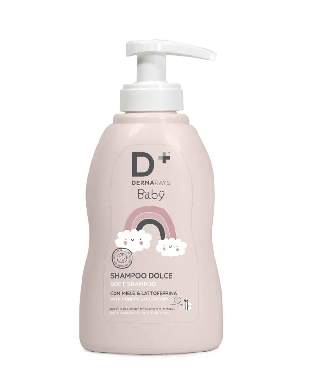 Șampon Baby DERMARAYS 200ml, recipient roz cu pompiță albă, design curcubeu și norișori.
