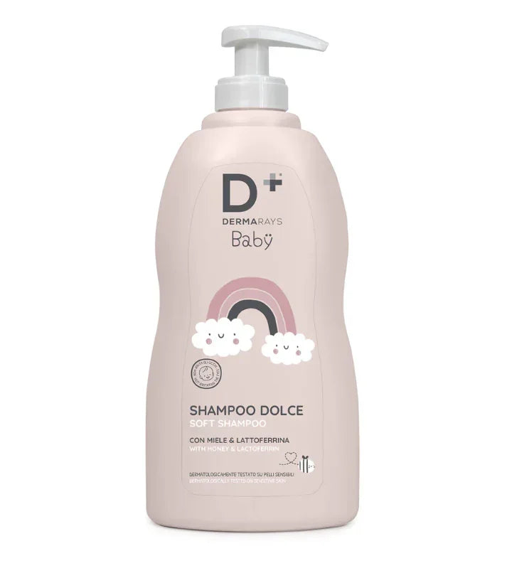Șampon Baby DERMARAYS 500ml, sticlă roz cu pompiță, desen curcubeu și norișori albi.